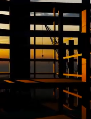 Commercial building under construction. Interior view with crane visible through the frame.