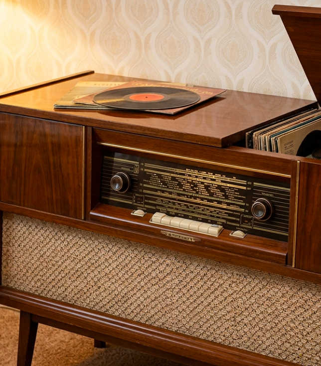 Retro radio and record player. Vintage wood cabinet with vinyl records. Classic audio equipment for radio ads.